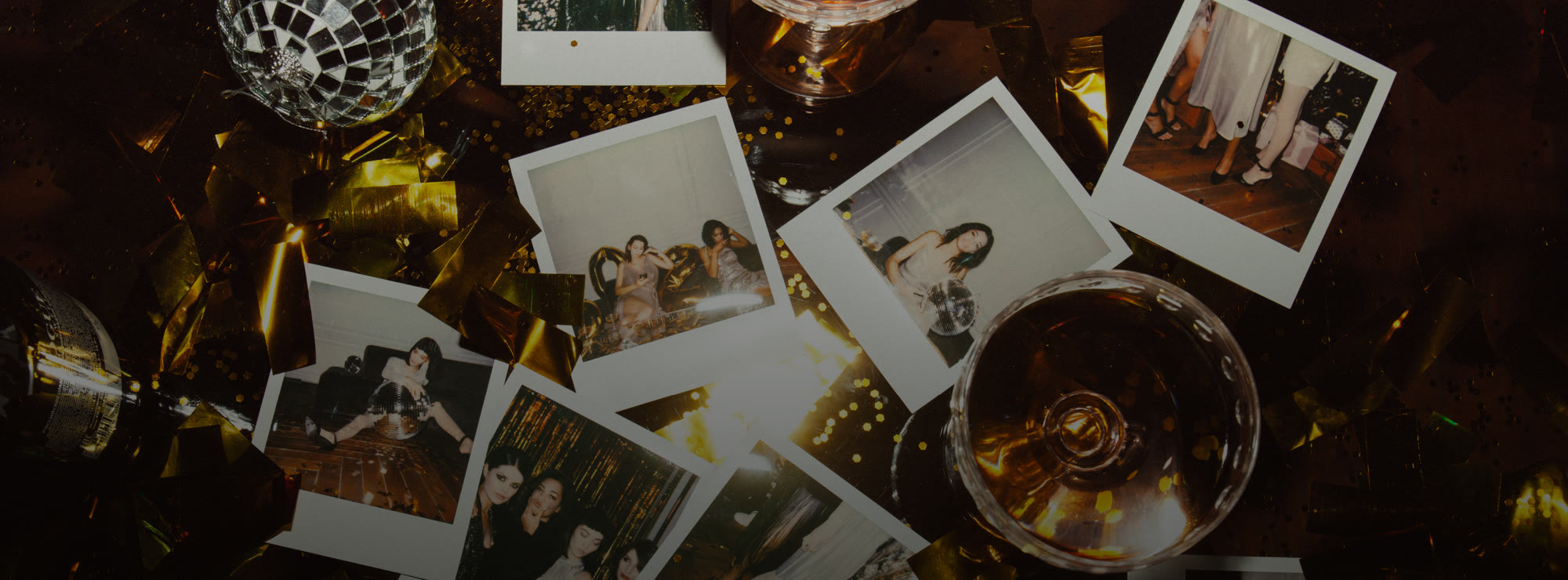 Photographs, candles and drinks laid out for an evening at the club
