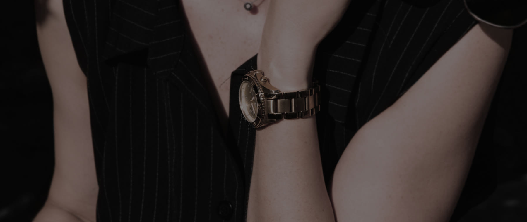 A knitted sleeve and a wristwatch
